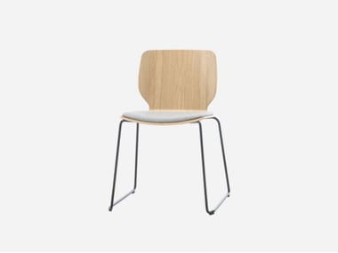 NIM - Sled base stackable wood veneer chair with integrated cushion by Inclass